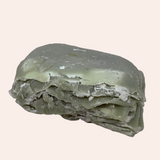 Greenish soap bar on a white background