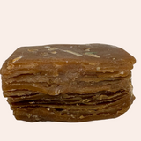 Stack of brown layered soap on a white background