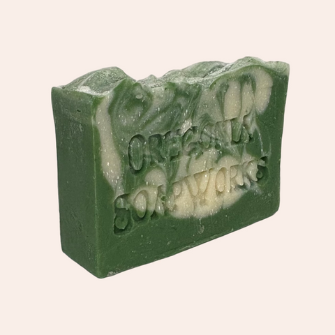Green bar of soap with 'Oregonia Soapworks' branding on a white back