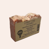 Bar of soap with a cardboard label on a gray background