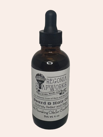 Bottle of Oregonia SoapWorks beard and hair oil on a gray background