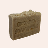 Bar of soap with 'Original Soapworks' branding on a light gray background