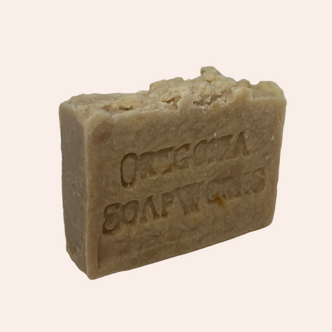 Bar of soap with 'Original Soapworks' branding on a light gray background