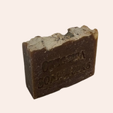 Bar of soap with 'Oregonia SoapWorks' branding on a light gray background