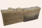 Two bars of soap with 'Oregonia Soapworks' branding on a light gray background.