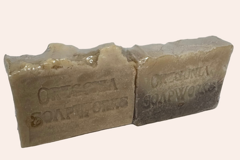Two bars of soap with 'Oregonia Soapworks' branding on a light gray background.