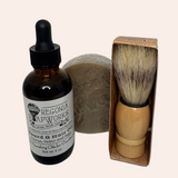 Oregonia Soapworks shaving set with bottle, brush, and soap on a white background