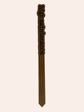 Wooden tool with 'high maintenance' text on a white background