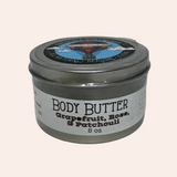 Jar of body butter with a label on a white background
